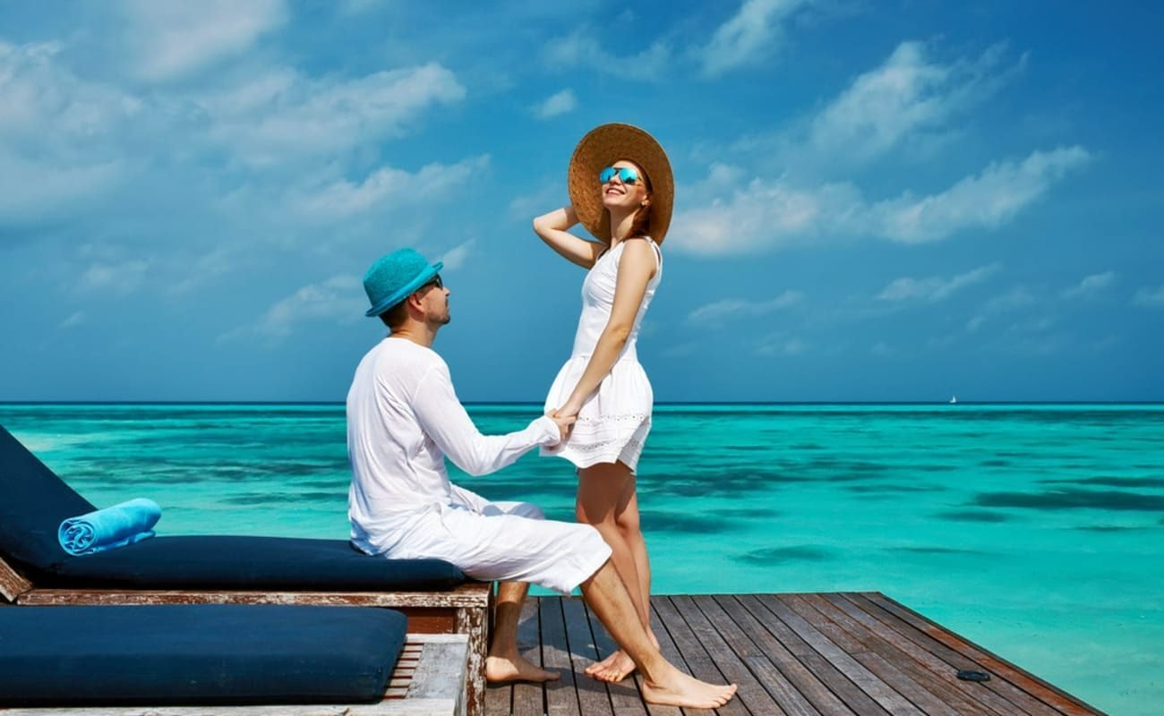 Couple honeymoon vacation package with romantic beach resort view and luxury travel experience in India