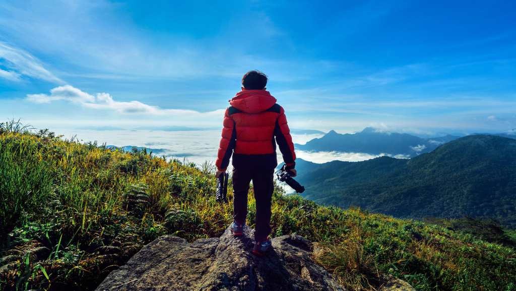 Solo traveler exploring the scenic mountains during a solo trip in India - Bhati Tours
